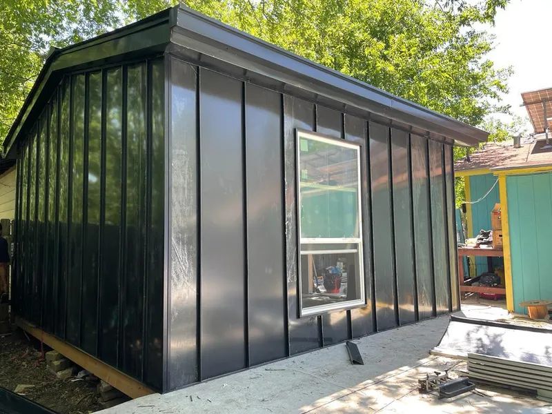 Black standing seam metal wall panels for Metal Roof Installation in Ionia