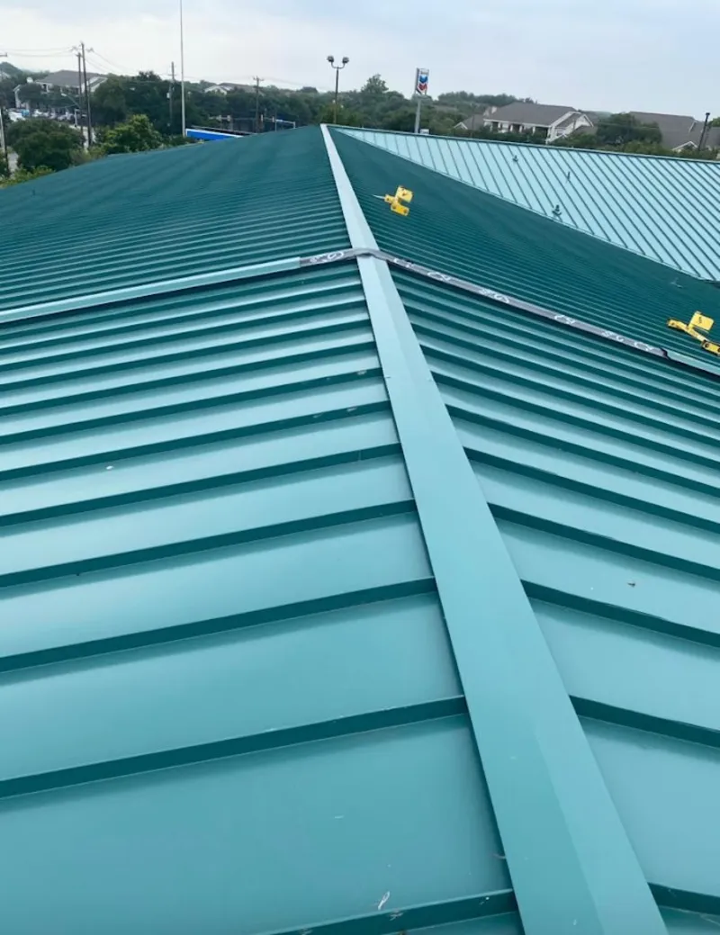 Green commercial metal roof ridge and valley for Metal Roof Repair in Ionia